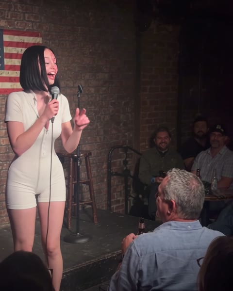 Comedy club with a US flag on the brick wall