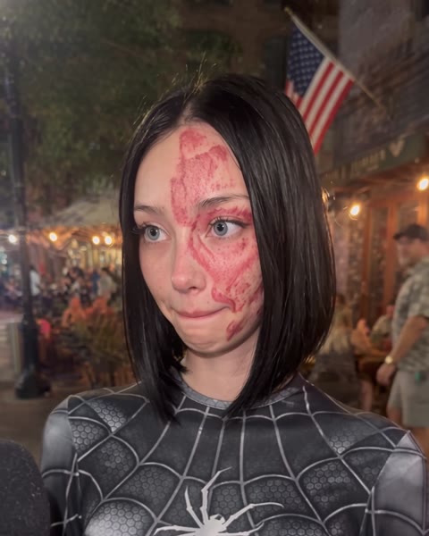Street interview with a US flag behind her